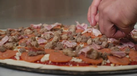 Placing Bacon Making Meat Lovers Pizza Commercial Industrial Restaurant Slow Video stock 66076248