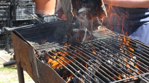 Placing A Bag Of Coal On A Grill Stock Footage 88988892