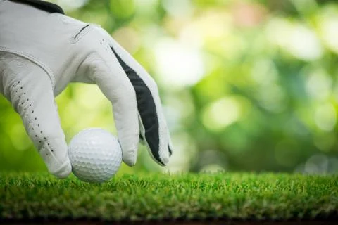 Placing ball on grass Stock Photos