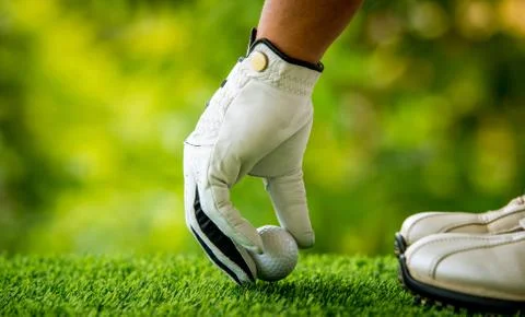 Placing ball on grass Foto stock