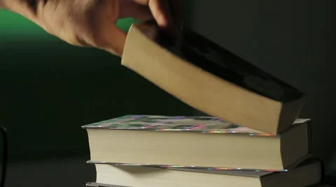 Placing books (overlapping) Video stock 54594921