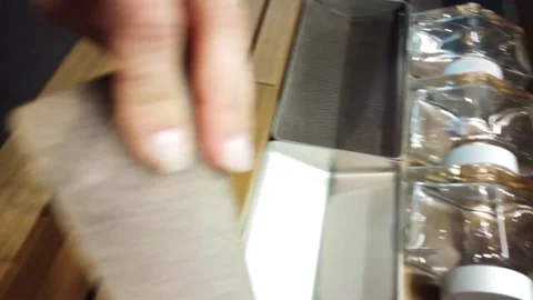 Placing Bottles: A Moment of Simple Organization Stock-Footage 307090308