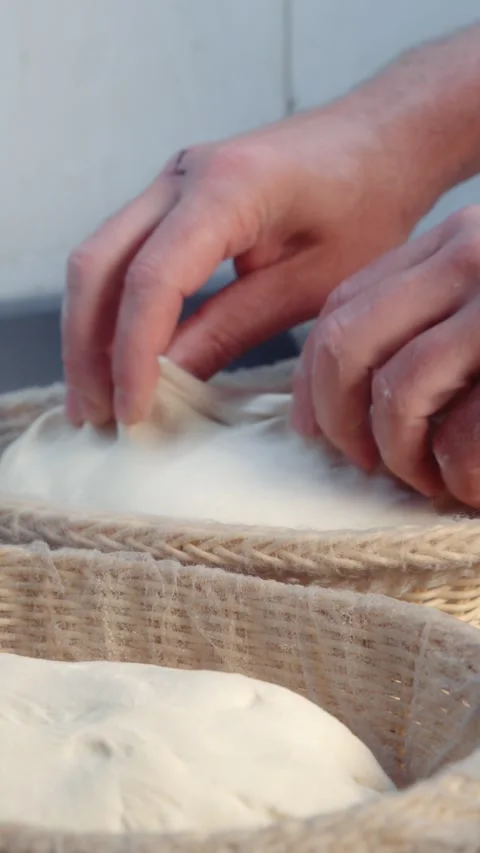 Placing Bread Dough into a Proofing Basket Stock Footage 344393187