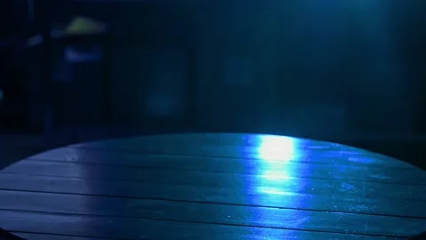 Placing briefcase on table in blue light Stockbeeldmateriaal 159673728