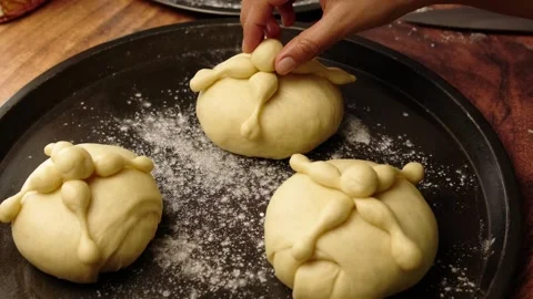 Placing the characteristic elements on a bread of dead, the bones and the skull Stock Footage 281460319