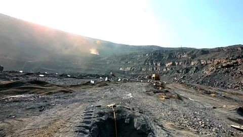 Placing a charge in the soil for blasting operations. Explosives in the quarry Stock Footage 162543349