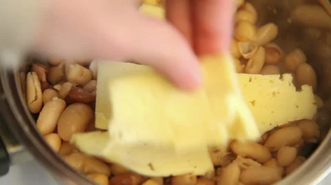 Placing cheese on beans Stock Footage 36727180