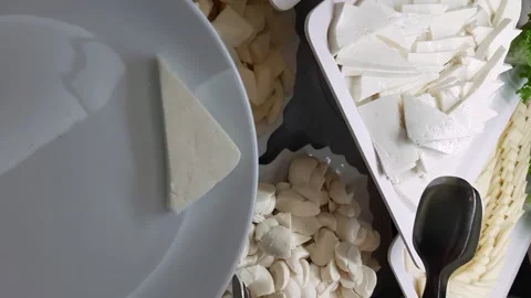 Placing Cheese Slices on a Plate Stock Footage 252027671