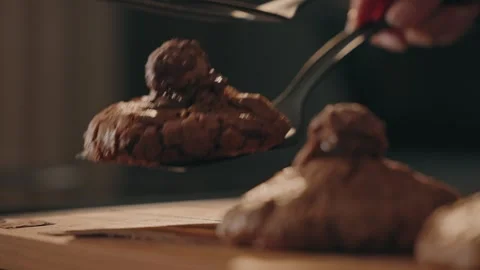 Placing chocolate truffle on cookie with spoon close up 스톡 동영상 330992962