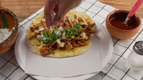 Placing chopped onion on a mexican taco Stock Footage 279199792