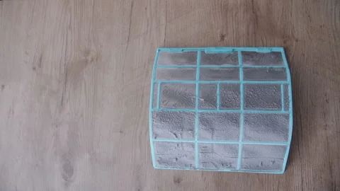 Placing Clean and Dirty Air Conditioner Filters Side by Side for Comparison 動画素材 341547022