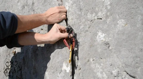 Placing climbing protection Stock Footage 24186917