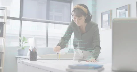 Placing compass on drafting table, designer scribing arcs and drawing lines for Stock Footage 314348975