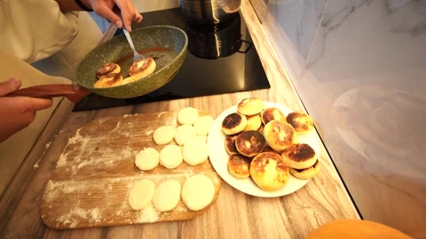 Placing the cooked donuts on a plate Stock Footage 318171656