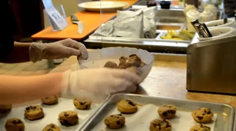 Placing cookie dough on sheets to bake Stock Footage 8960940