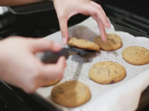 Placing cookies on a plate Stock Footage 80740089