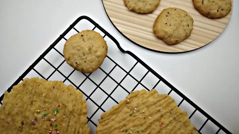 Placing cookies on wire cooling rack. Stock Footage 293005363