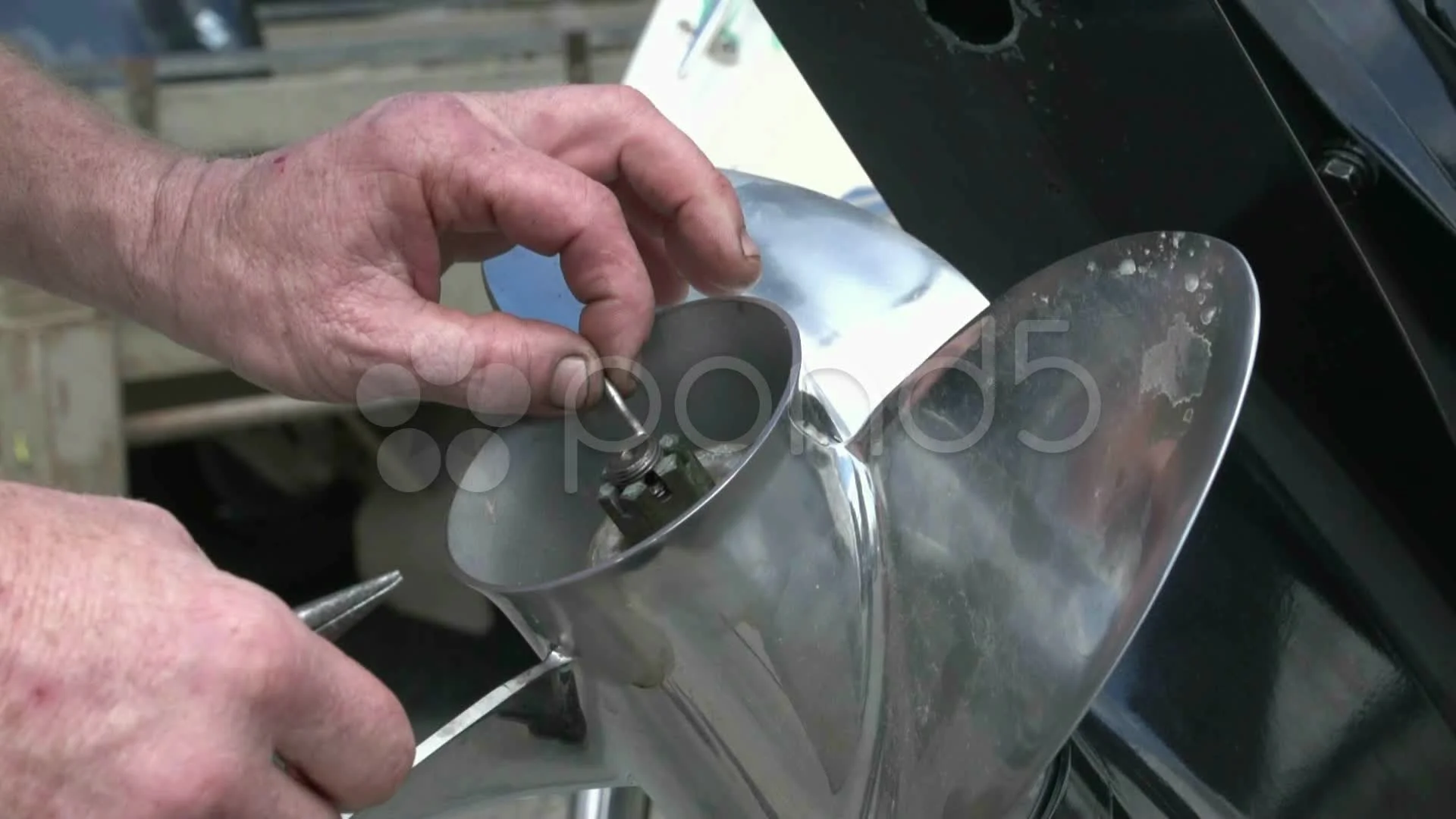 Placing Cotter pin on boat propeller, Stock Video
