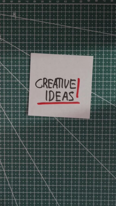 Placing Creative Ideas paper note on green cutting mat Stock Footage 341246094