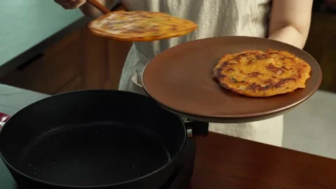 Placing Crispy Kimchi Pancake on Plate Stock Footage 334160181
