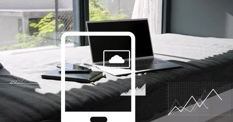 Placing darkscreen laptop on bed by window, showing notebook smartphone pen Stock Photos