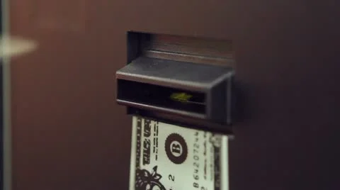 Placing Dollar into change machine Stock Footage 10860768