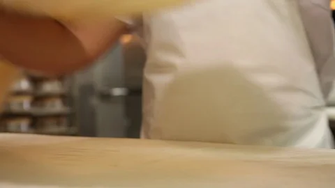 Placing dough over table Stock Footage 77053329