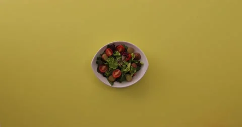 Placing an egg on a salad 2 Stock Footage 132147011