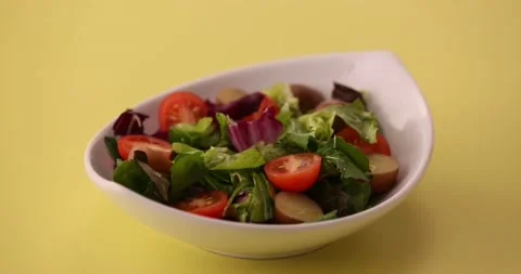 Placing an egg on a salad 4 Stock-Footage 132147045