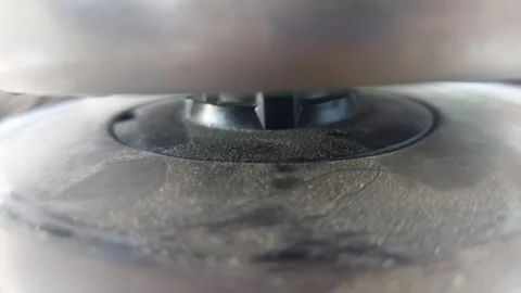 Placing an electric kettle on its power base close up Stock Footage 334679033