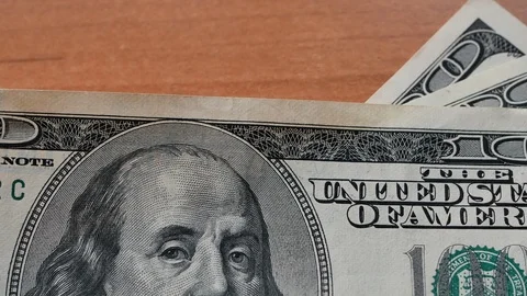 Placing few hundred us dollars on desk 库存影片 102126483