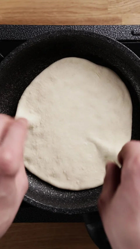 Placing Flatbread Dough Into Frying Pan Top View Видео 330572719