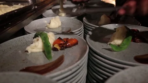 Placing food on plates Video stock 74475490