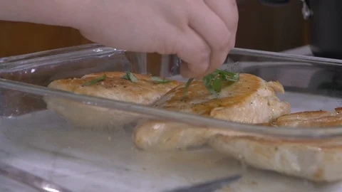 Placing Fresh Basil on Chicken Stock Footage 98601976