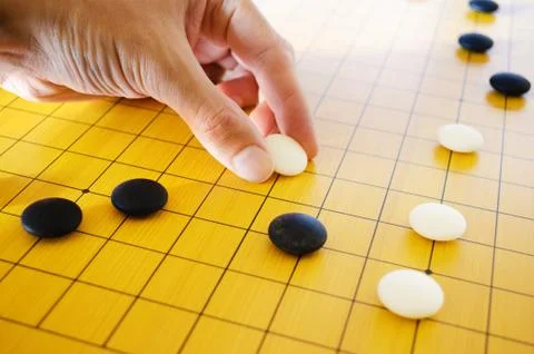 Placing go stone Stock Photos