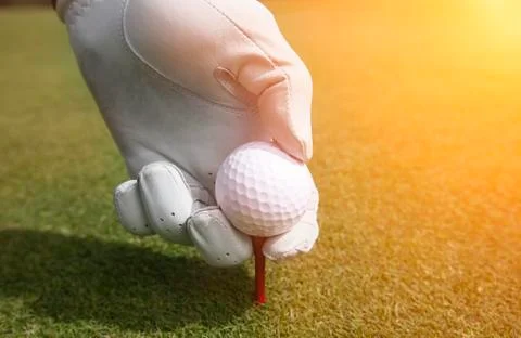 Placing golf ball on a tee Stock Photos