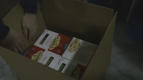 Placing Groceries into an Empty Box Stock Footage 139313401