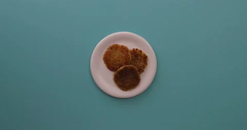 Placing hash brown on a plate 1 Stock Footage 132149748