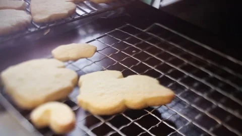 Placing a Hot Cookie from Oven to Cooling Rack Stock Footage 83793653