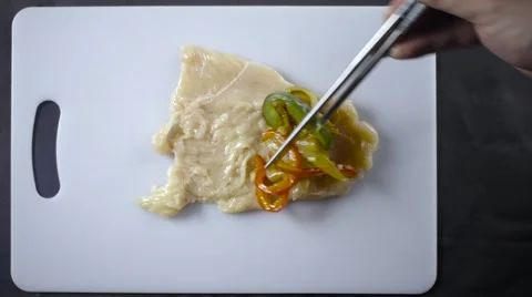 Placing Ingredients Into stuffed chicken Video stock 61325952