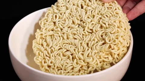 Placing Instant Noodle Block Into White Ceramic Bowl Stock Footage 315274418