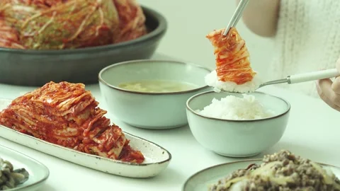 Placing Kimchi on Rice Stock Footage 334699231