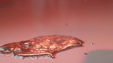 Placing ladle beside puddle of silver molten metal Stock Footage 147356191