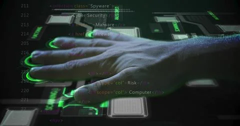 Placing left hand on glowing touchscreen panel at dark workspace, with green Stock Photos