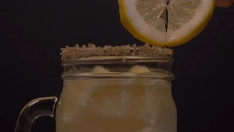 Placing Lemon Slice on Jar with Sugar Coating on Brim 4K 스톡 동영상 131110521