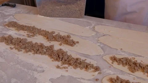 Placing meat by hand in Bafra style Turkish pizza aka pide Stock Footage 242944756