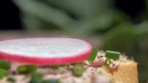 Placing the mint leaves on a sandwich with a paste. Slow motion Stock Footage 105877604