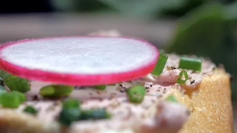 Placing the mint leaves on a sandwich with a paste. Slow motion Vídeos de archivo 105877642