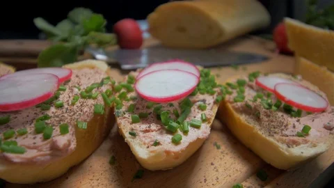 Placing the mint leaves on a sandwich with a paste Stock Footage 105877738