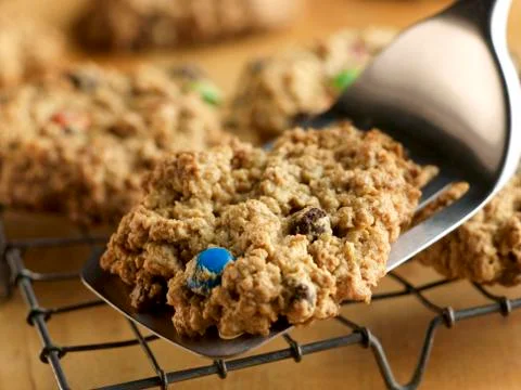 Placing M&amp;M Cookie on a Cooling Rack with a Spatula Stock Photos